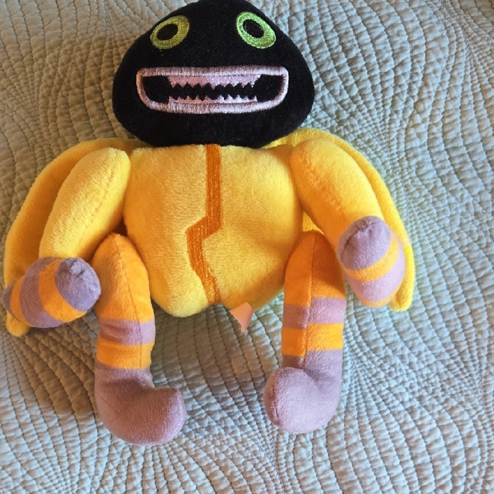 Yellow and Black Plush Toy